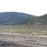 Revegetation workers working on soil on hillside at Tsē Zūl.
