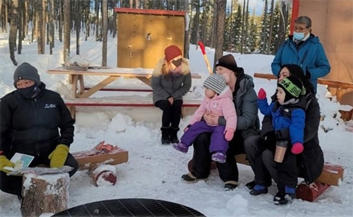 Students from KDFN's Dusk'a Head Start Family Learning Centre gather around the firepit